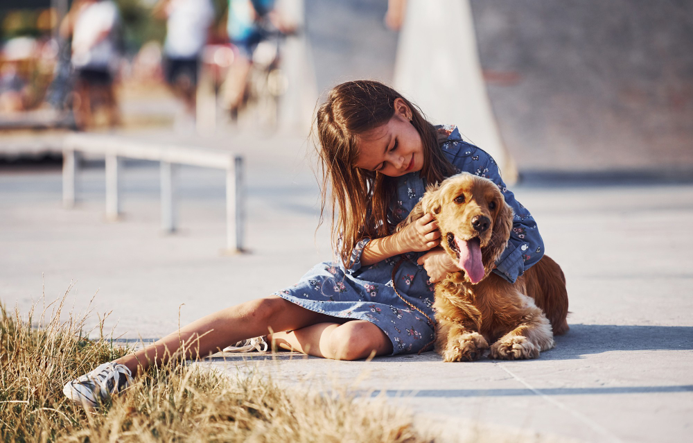 A family festival with attendees of all ages, including furry friends.
